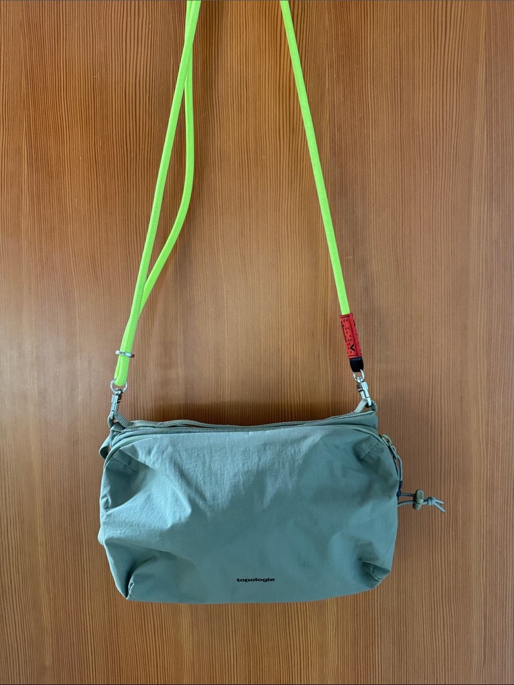 Topologie Saccoche Sage Green Water Bottle Crossbody Bag with Neon Yellow Strap